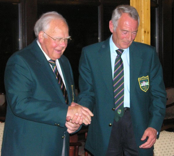 Dennis Baker congratulating Don Thatcher (on the left)