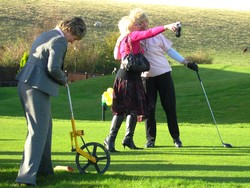 Megan Bibby measures Josie Knight's drive-in