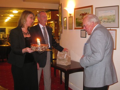 Club President, Don Thatcher, receiving his 80th birthday cake