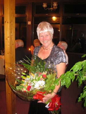 Outgoing Ladies Captain, Shirley Blount, with farewell bouquet